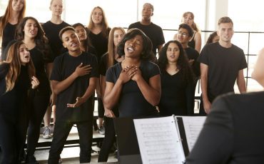 male-and-female-students-singing-in-choir-with-teacher-at-performing-arts-school.jpg male-and-female-students-singing-in-choir-with-teacher-at-performing-arts-school.jpg